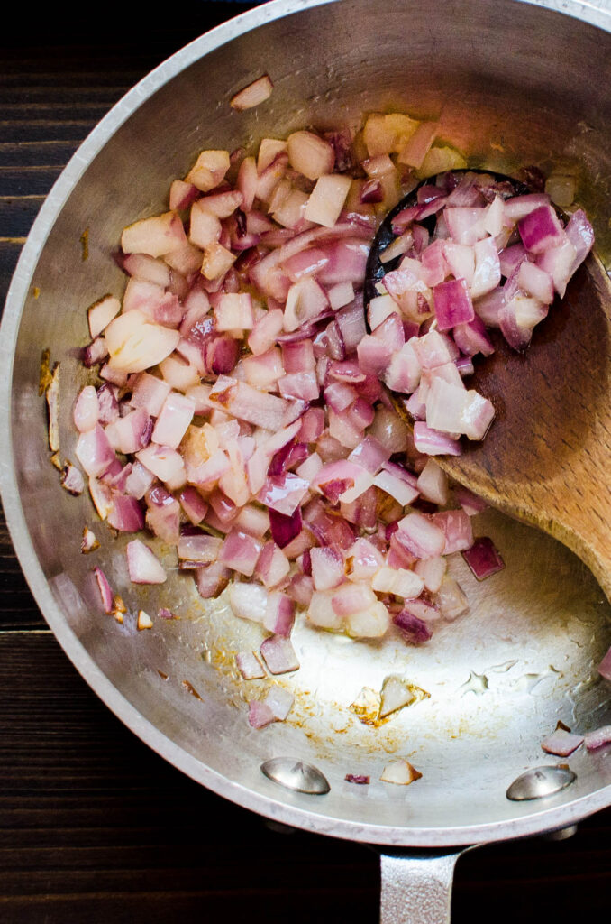 sweating red onions until soft and sweet.
