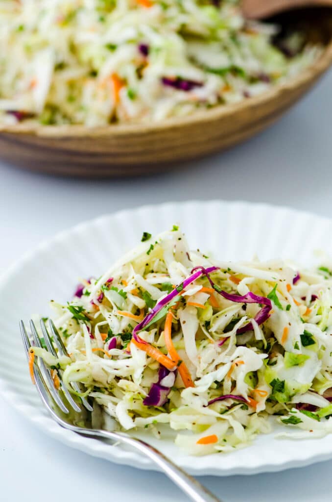 A serving of slaw on a paper plate. Good for fish tacos too.