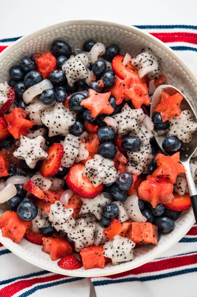 an overhead shot of the fruit salad with dressing.