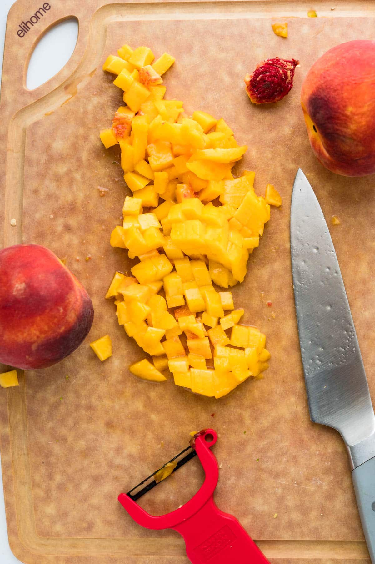 Chopping peaches on an Elihome cutting board.