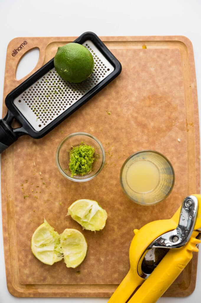 zesting and juicing limes.
