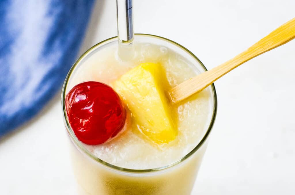 a creamy, icy blender drink in a glass with garnish,