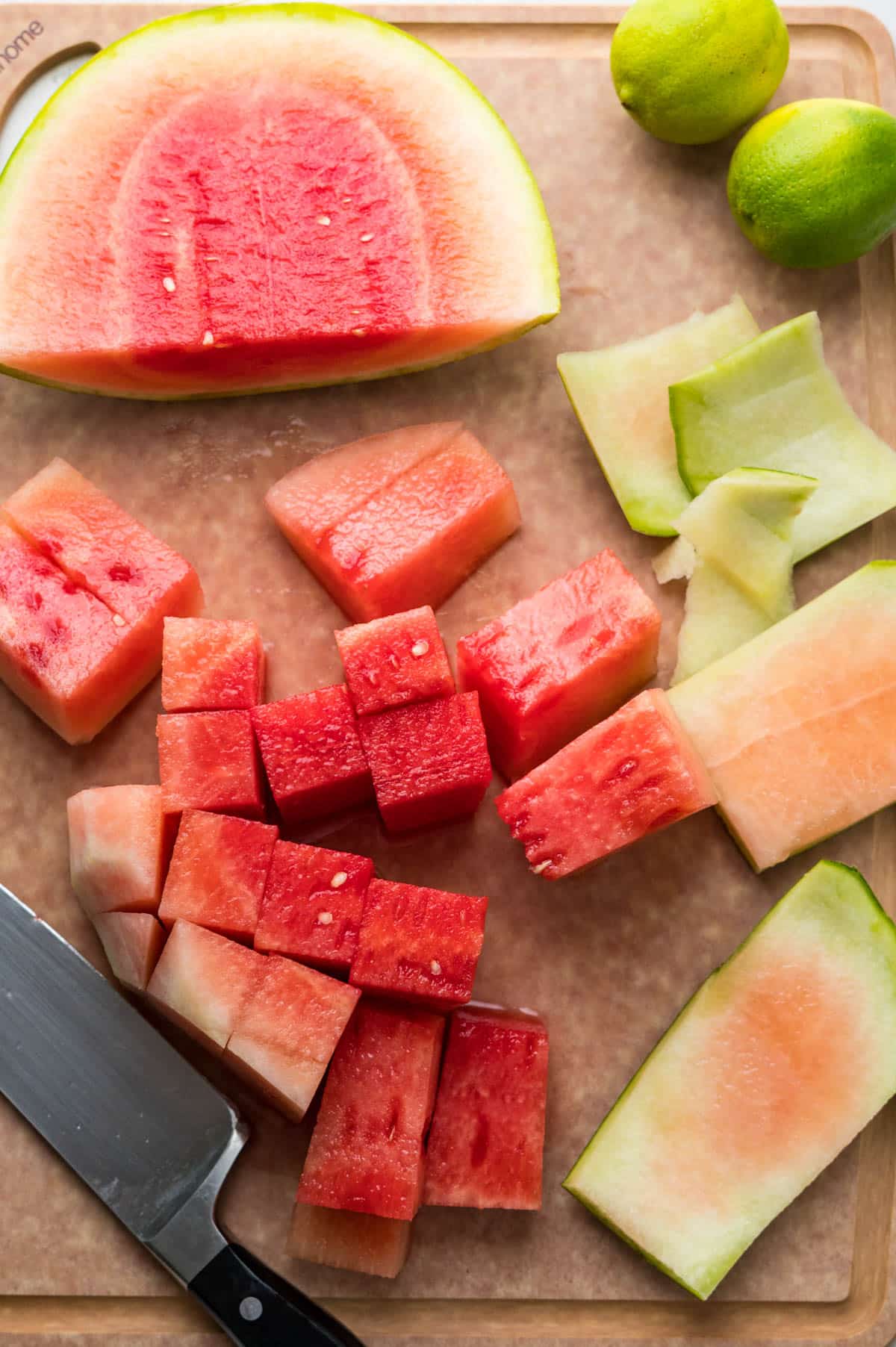 cutting watermelon on a cutting board.