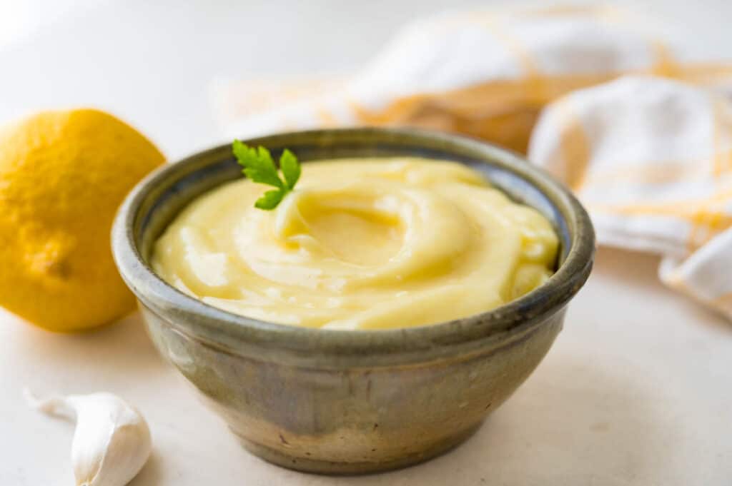 Serving aioli sauce in a bowl.