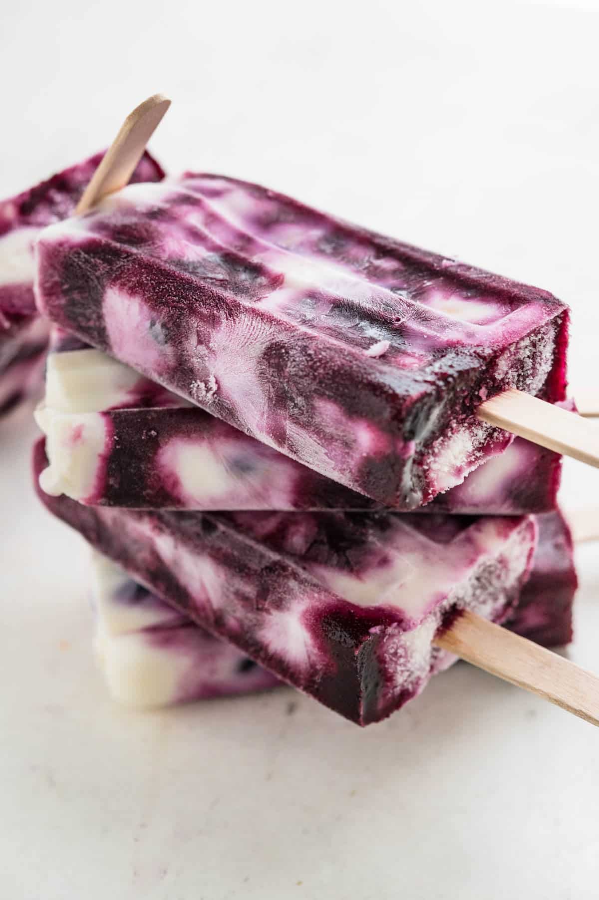 a stack of blueberry yogurt popsicles.