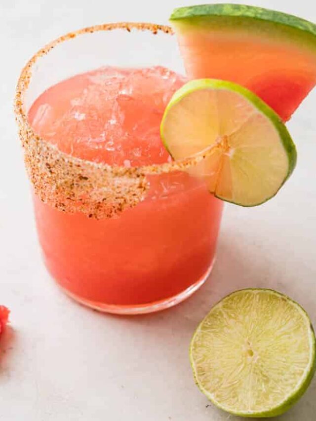a watermelon margarita with fresh fruit and lime.