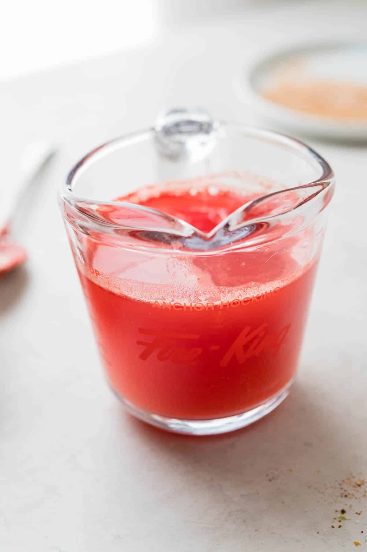 a container of fresh watermelon juice.
