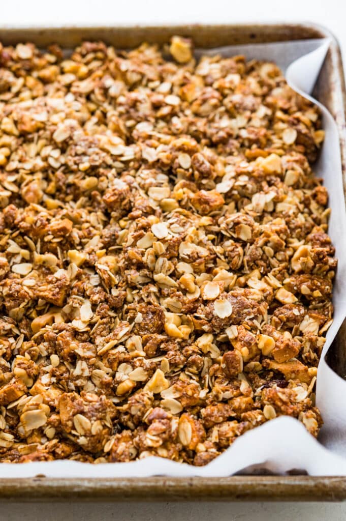 press the granola into a sheet pan to bake.