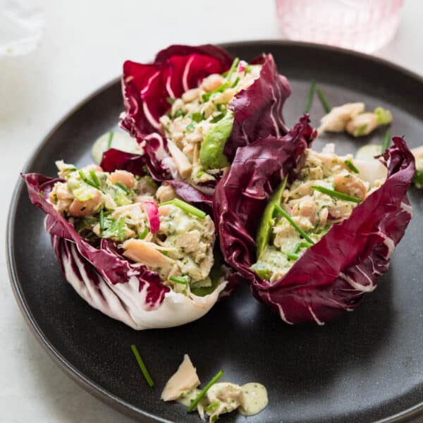 tuna white bean lettuce cups on a grey plate.