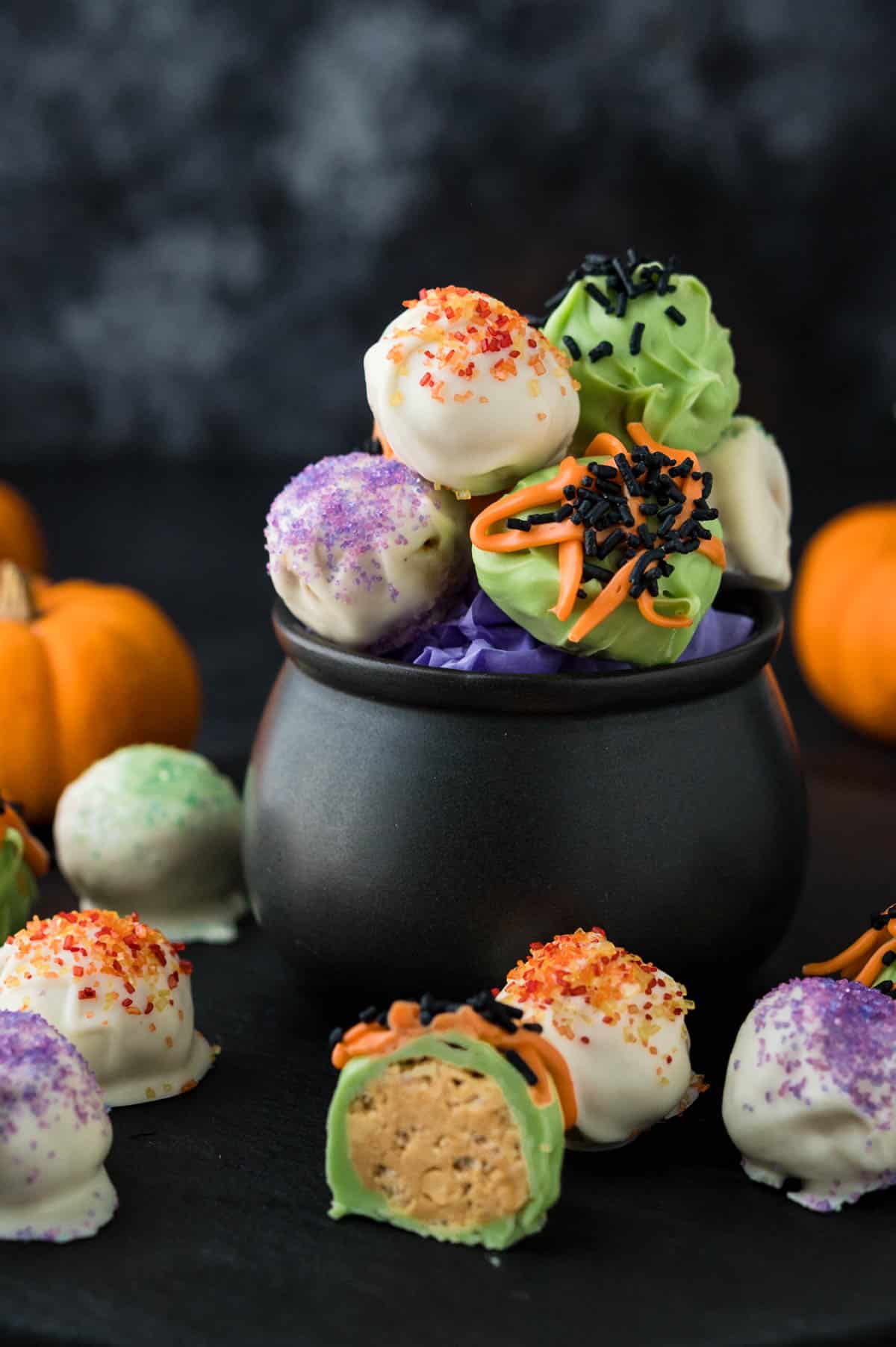 A variety of peanut butter balls decorated for Halloween.