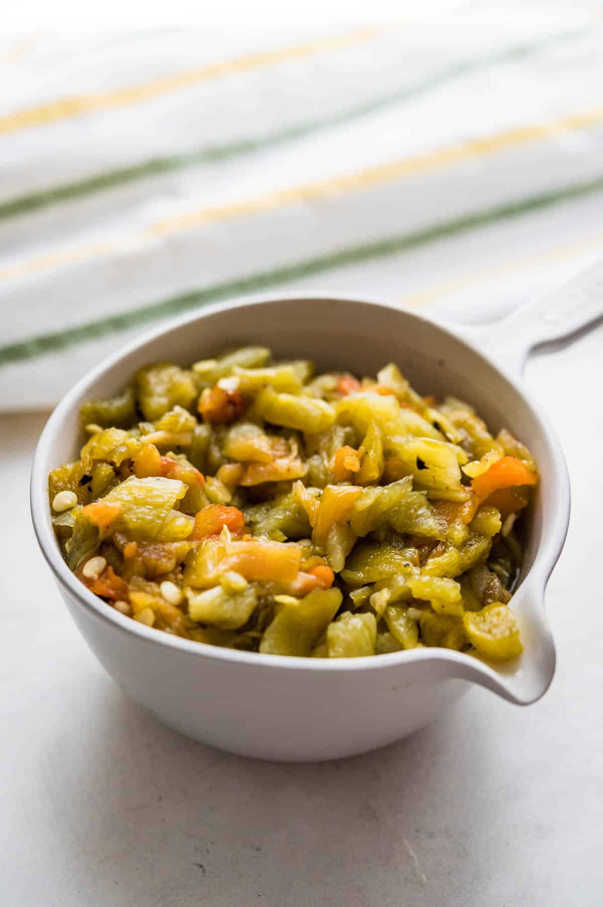 chopped hatch chiles in a cup.