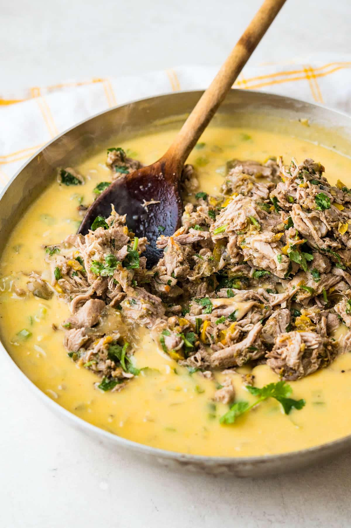 stirring in leftover pulled pork to the cheese sauce.