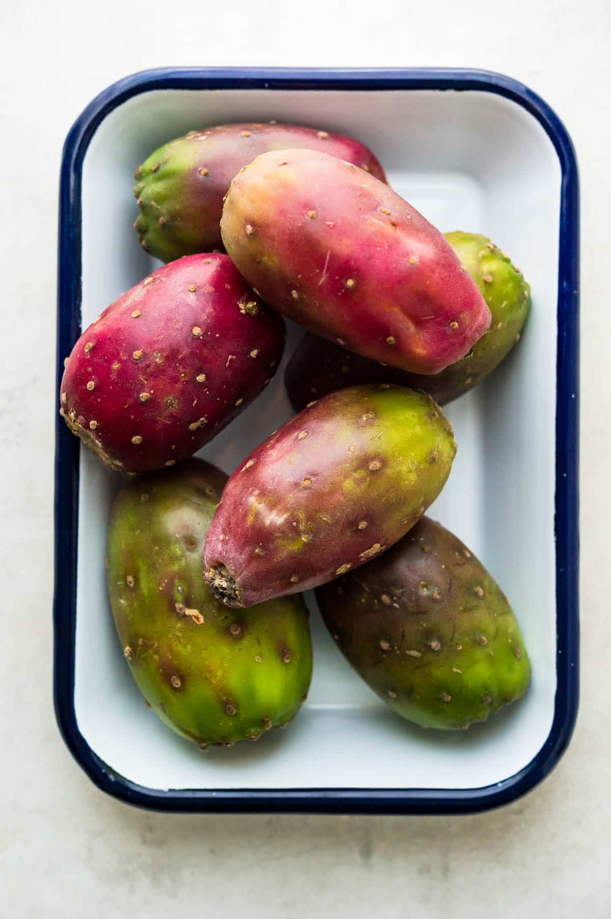 prickly pears on a white platter.