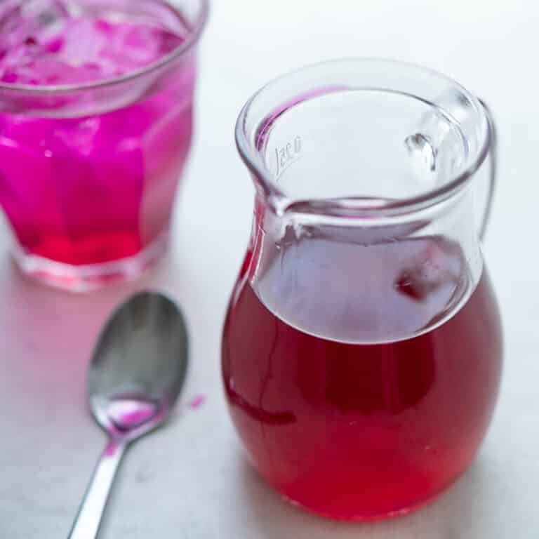 prickly pear syrup in a carafe.
