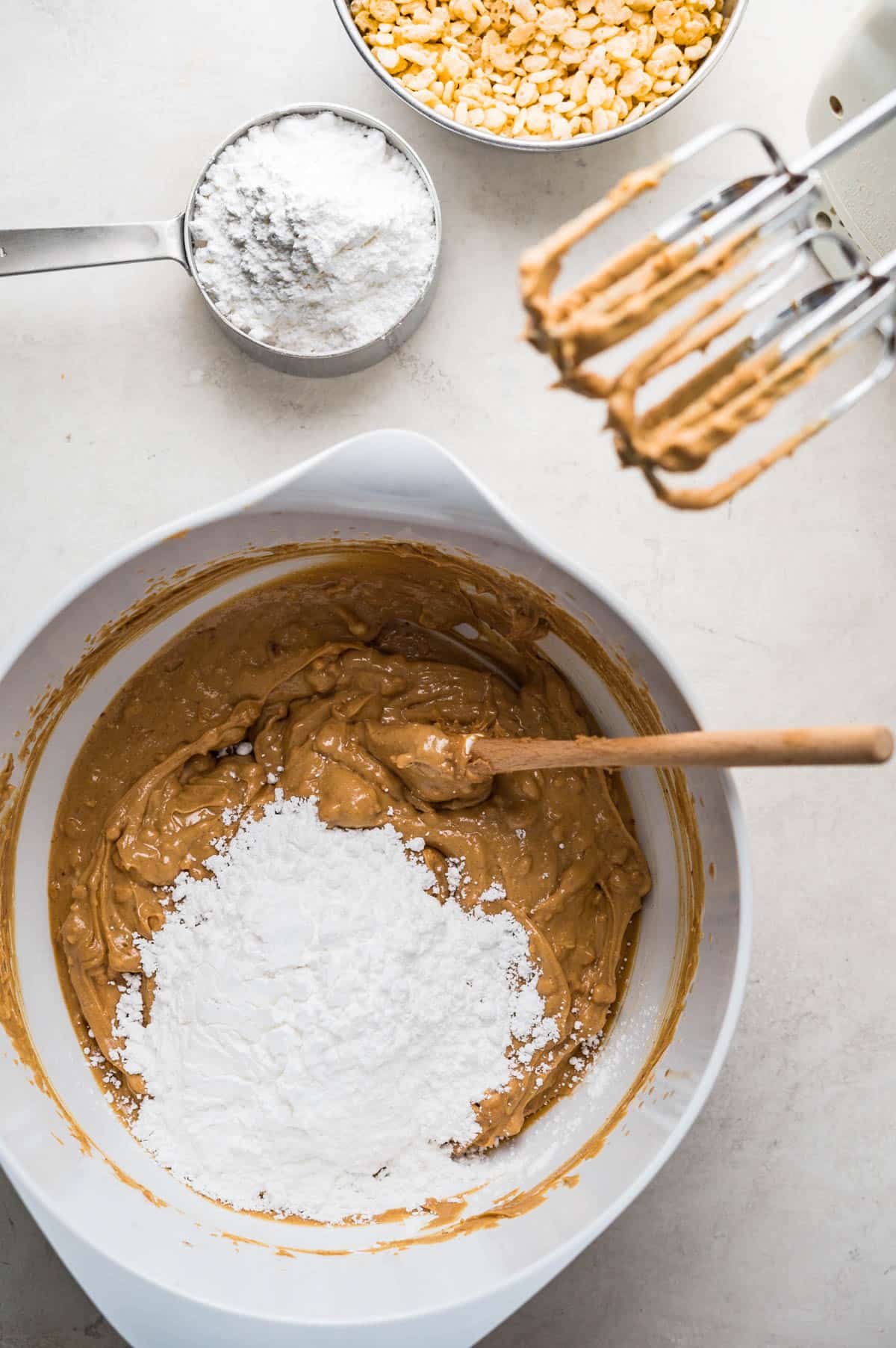 blending confectioner's sugar with the peanut butter mixture.