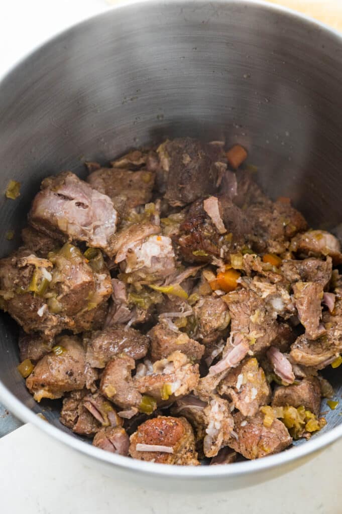 transfer the meat to the bowl of a stand mixer.