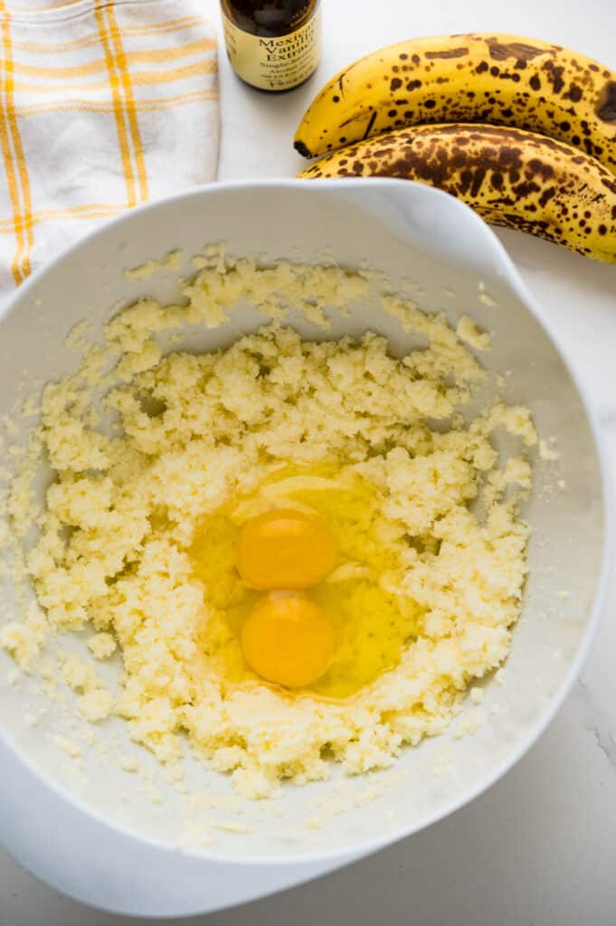 After creaming the butter and sugar together, add the eggs to beat into the wet ingredients.