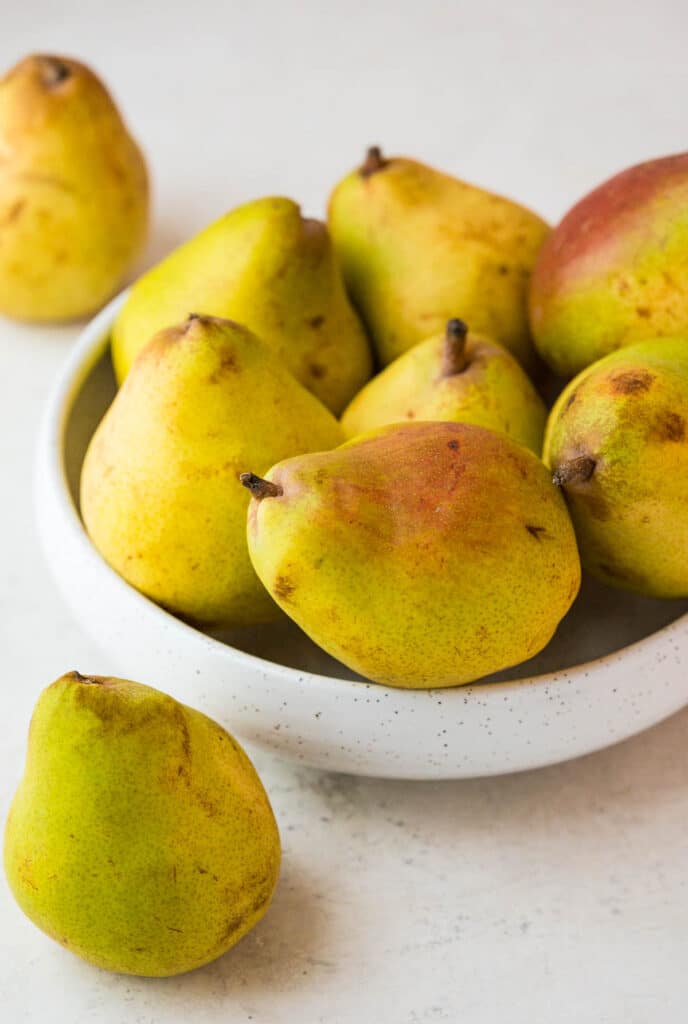 a bowl of ripe pears. 