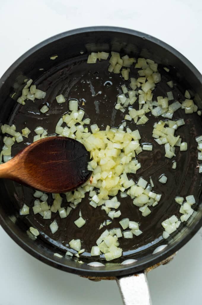 sauteing onions in a skillet.