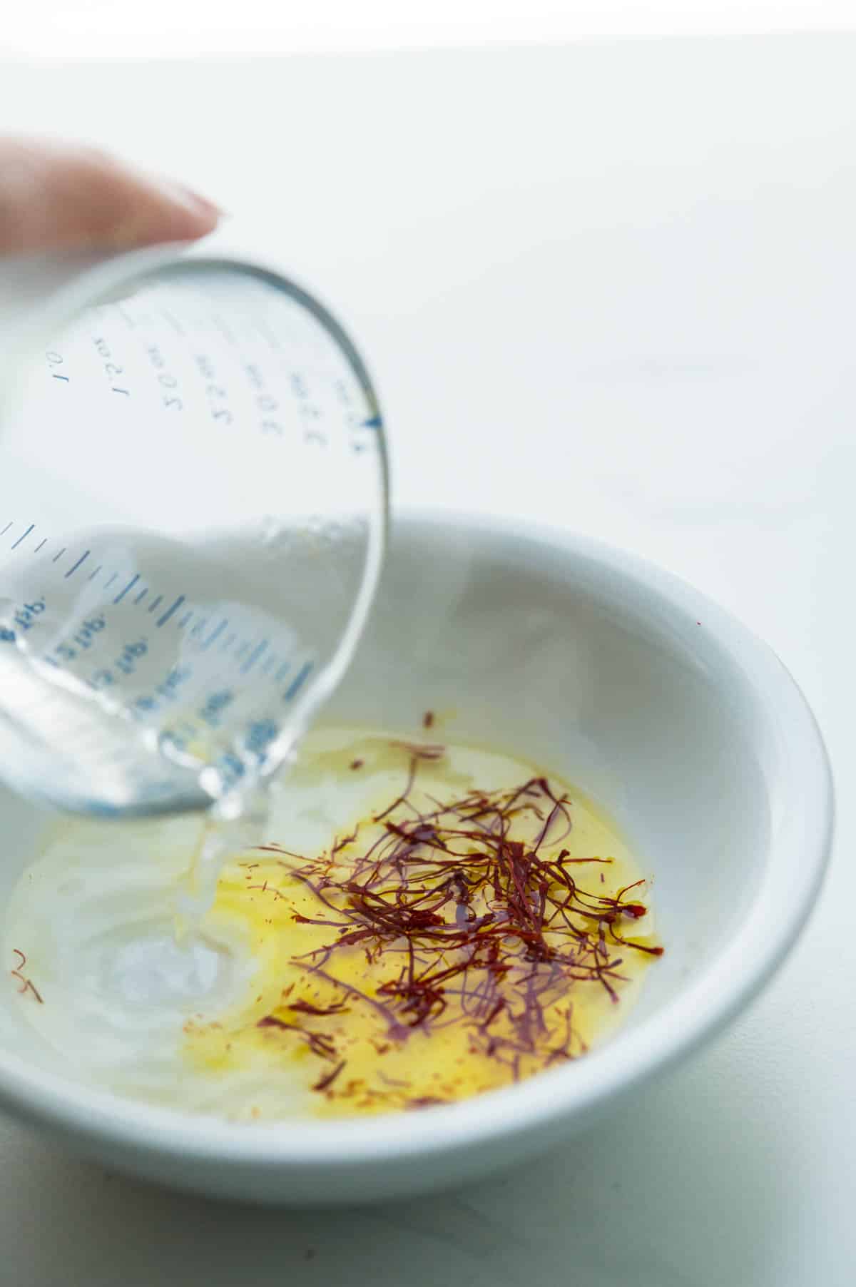 blooming the saffron with hot water.