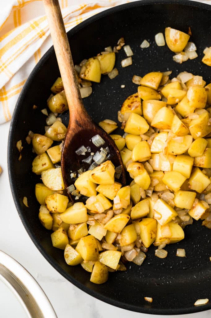 a skillet of browned onions and potatoes.