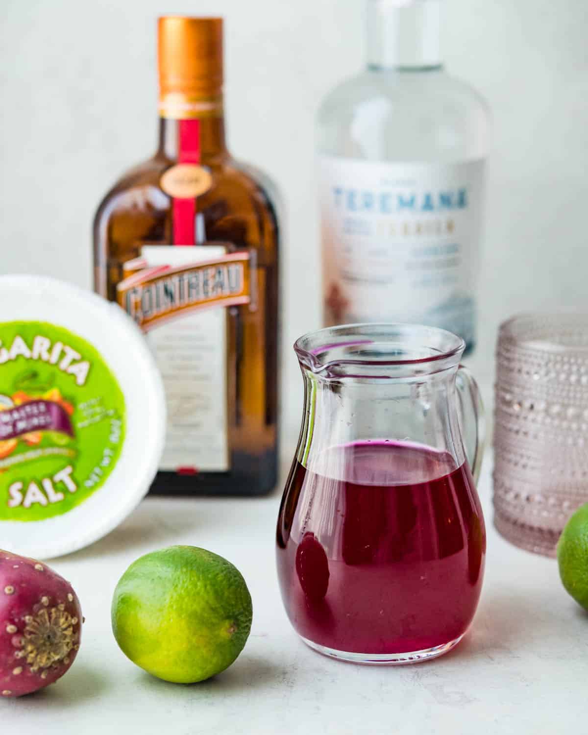 The ingredients to make the prickly pear margarita recipe are prickly pear syrup, Cointreau, lime juice and Tequila.