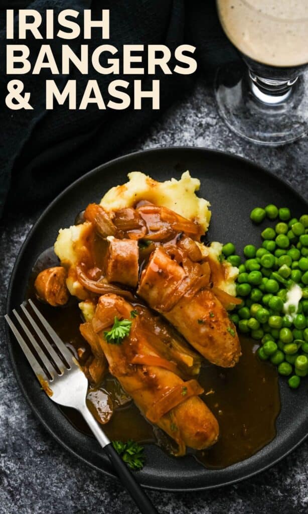 A pin to save on pinterest with a photo of the pork sausages and onion gravy over a bed of mashed potatoes and peas.