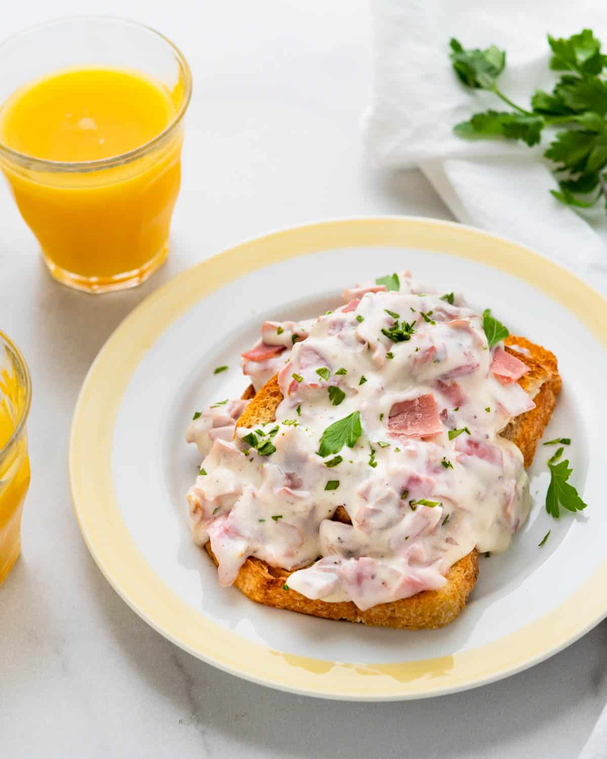A serving of the chipped beef recipe on a plate with a yellow border.