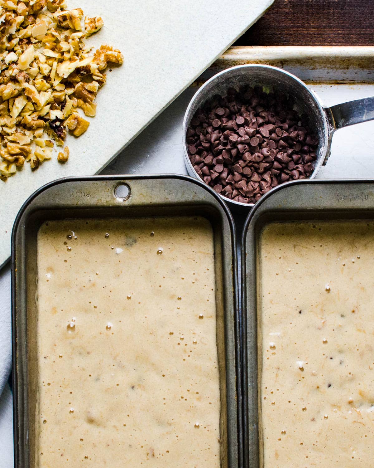 Filled loaf pans with banana bread batter. Extra chocolate chips and walnuts for topping.