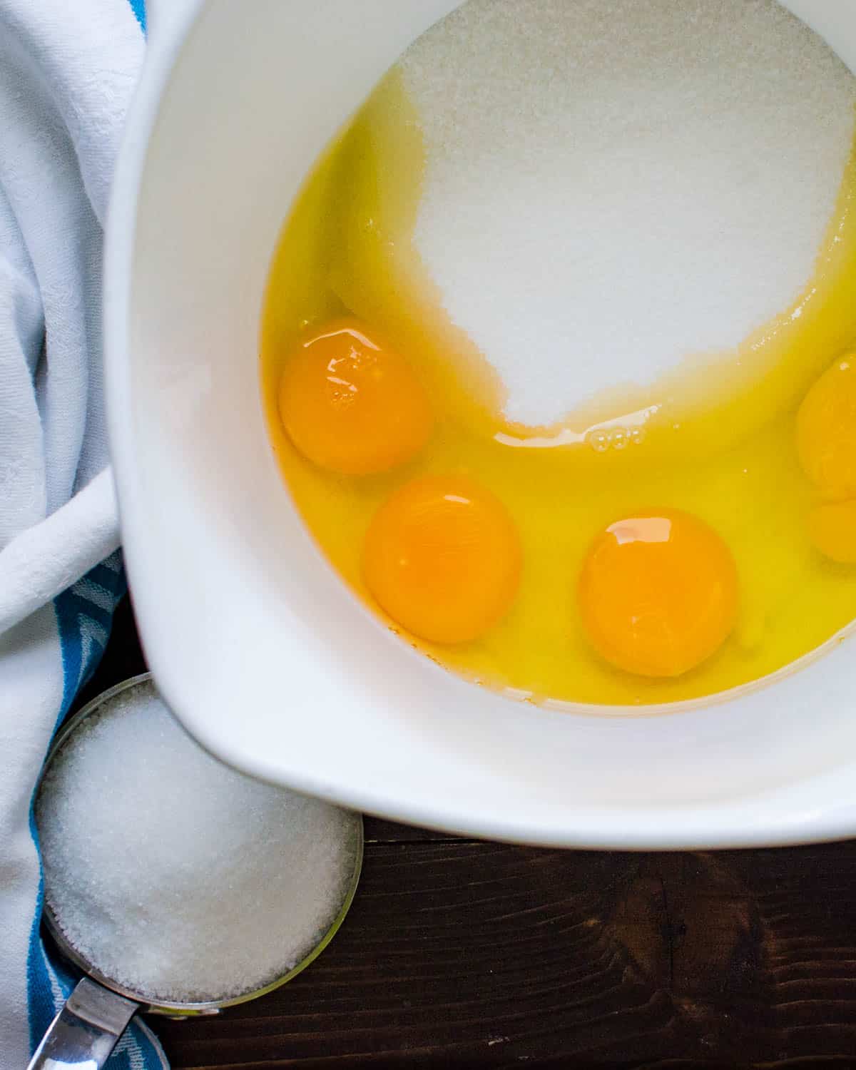 Sugar and eggs in a bowl.