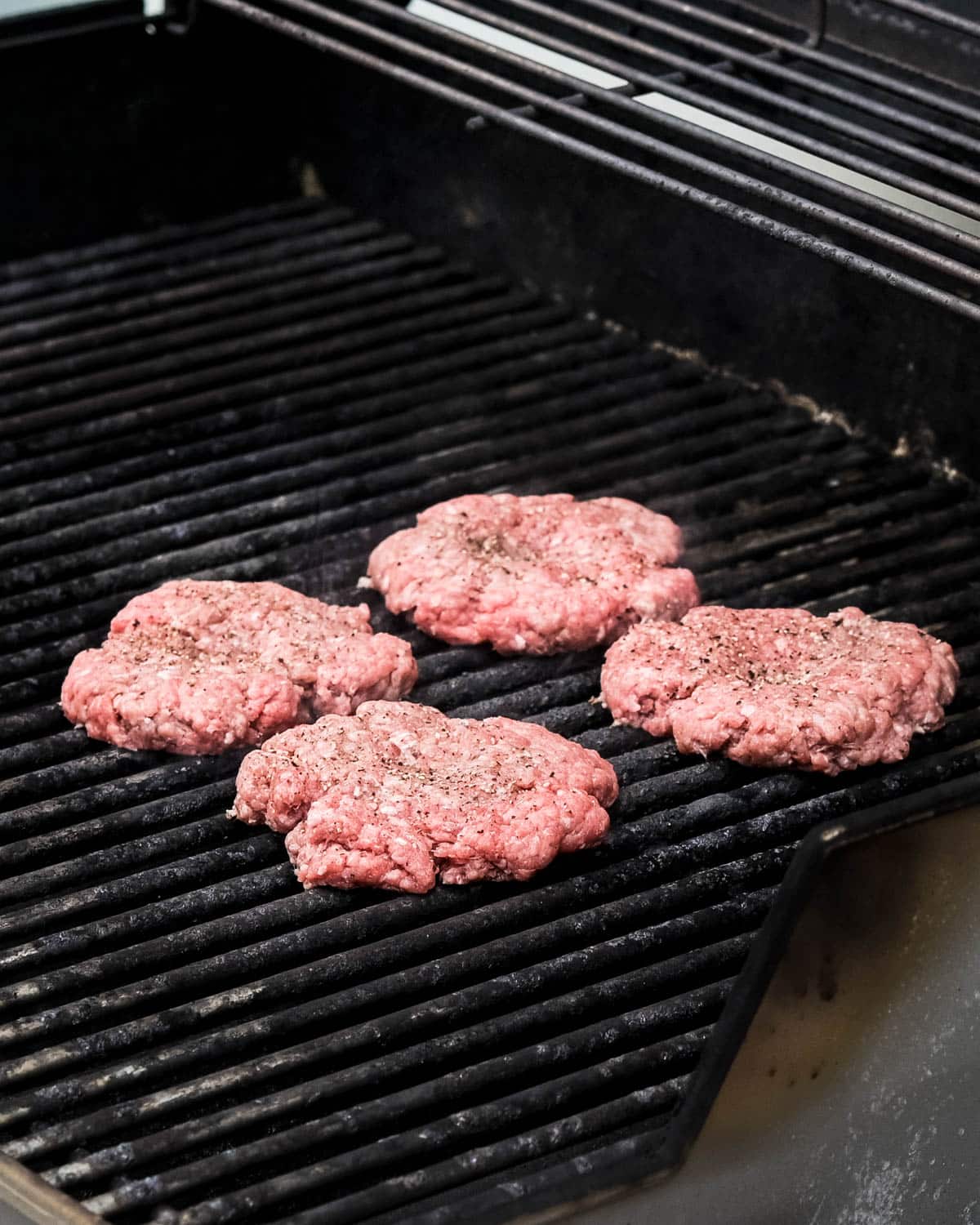 Burgers on the grill to cook.