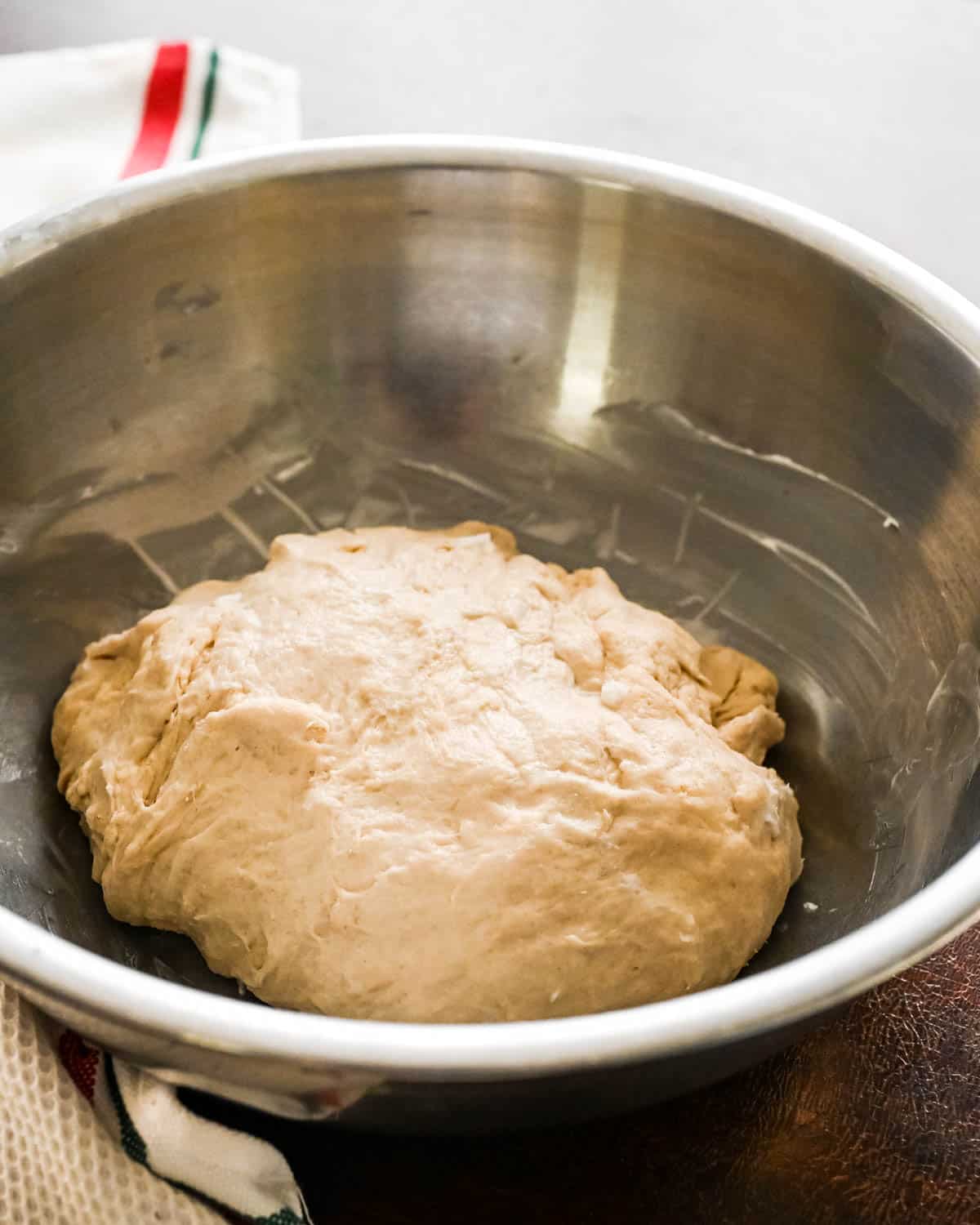 I place the ball of dough in a greased bowl to rise overnight.