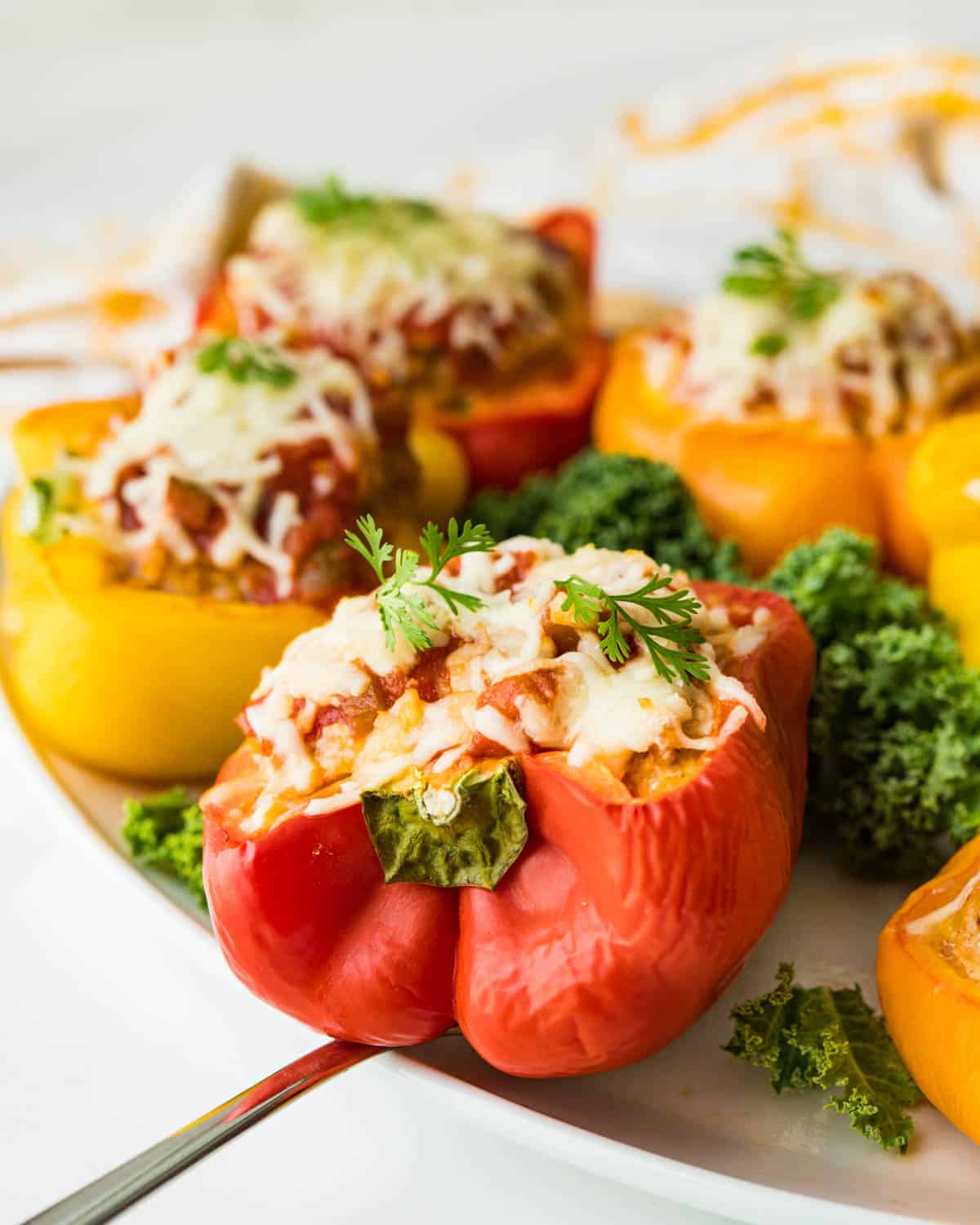 Serving the Mexican stuffed peppers on a platter.