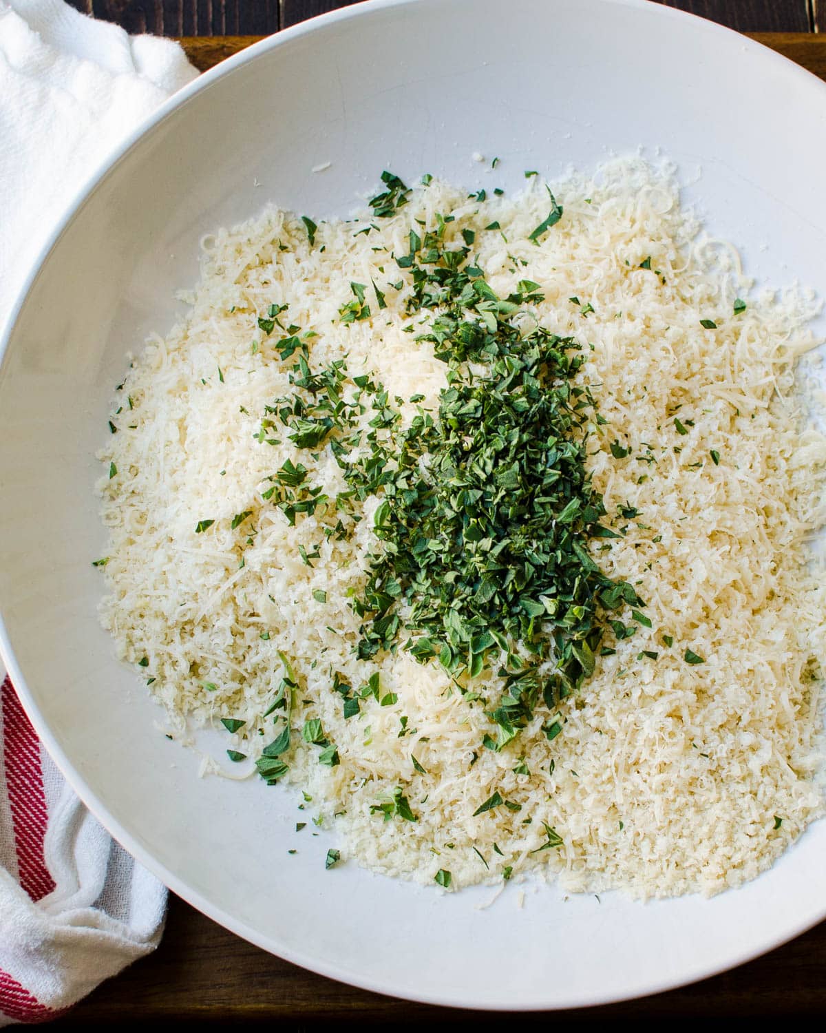 Breadcrumbs, cheese and fresh oregano in a bowl for the oyster crust.
