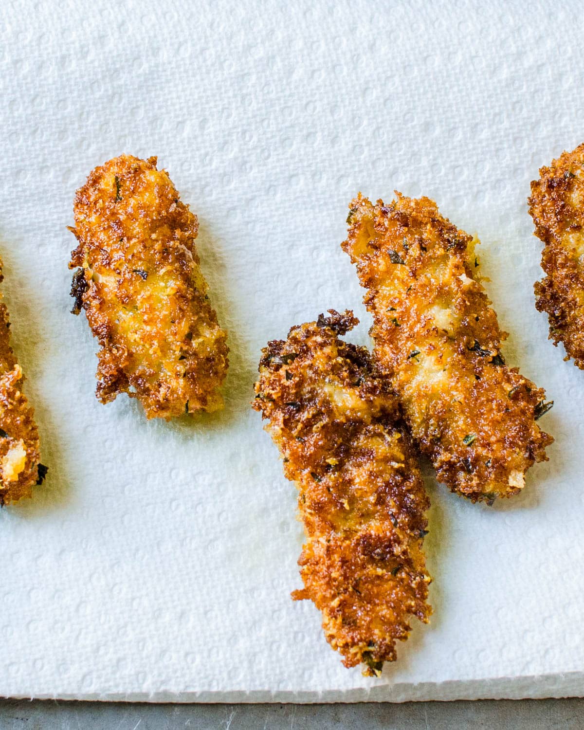 Drain the fried oysters on paper towels.