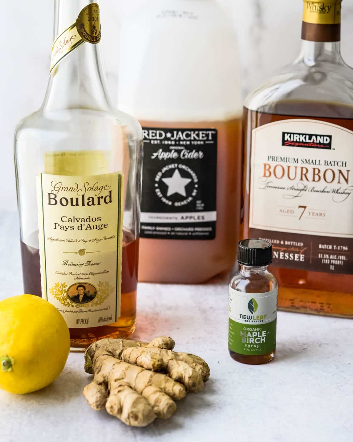 Ingredients for the ginger bourbon cocktail with apple cider.