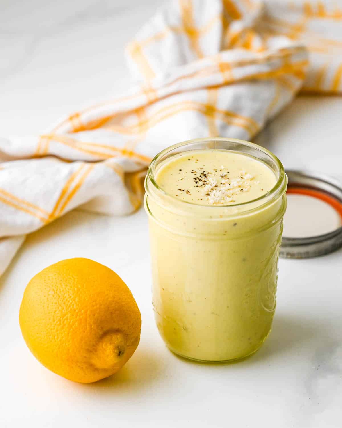 a jar of creamy lemon garlic kale salad dressing