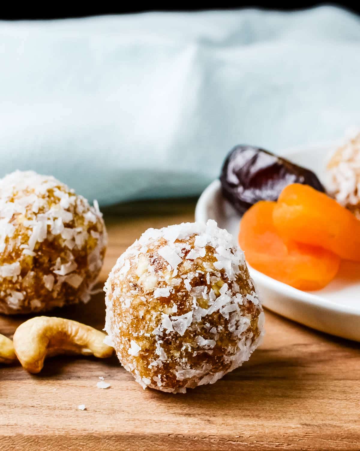 A close-up image of the date balls with apricots and cashews.