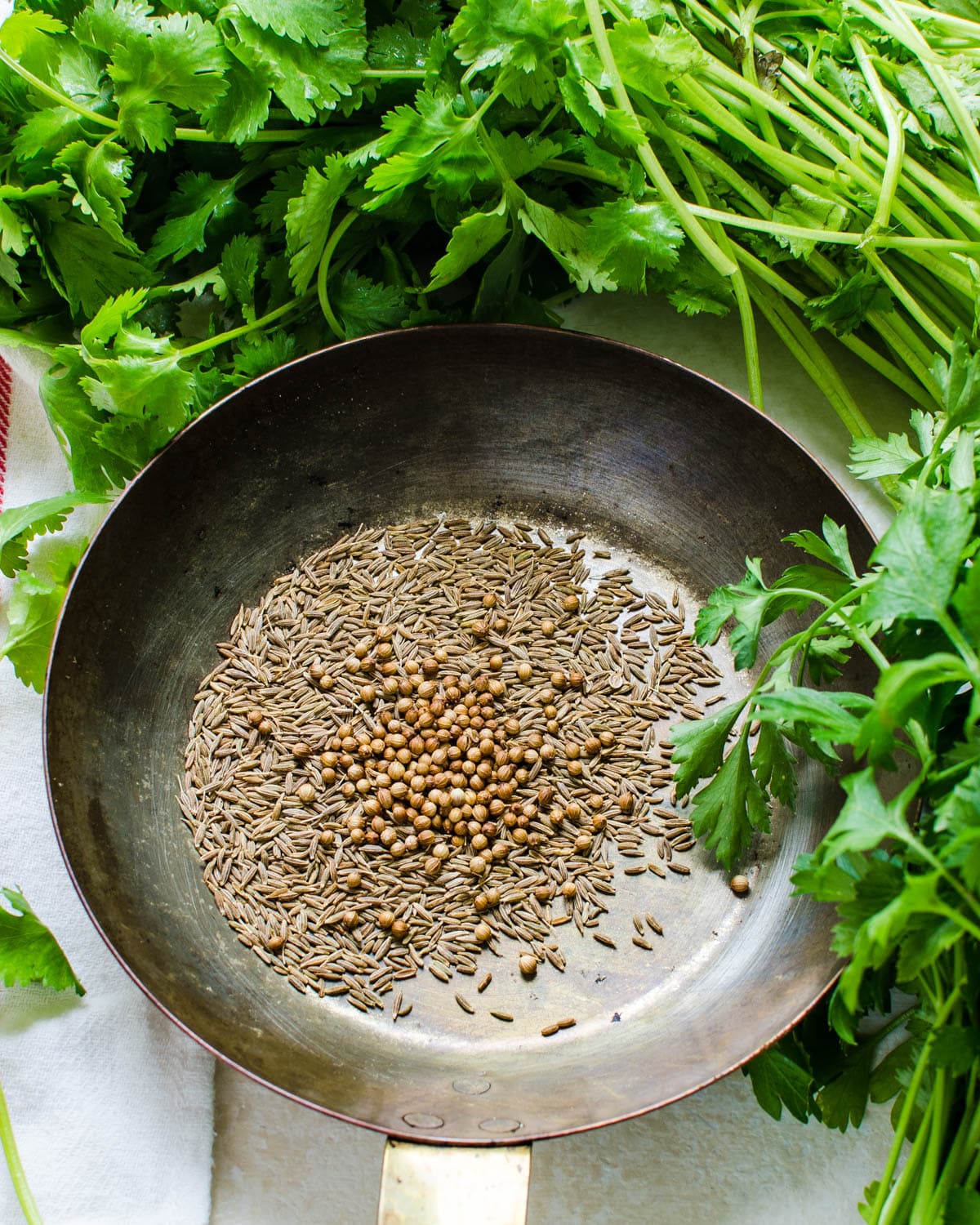 toasting the cumin and coriander in a skillet.