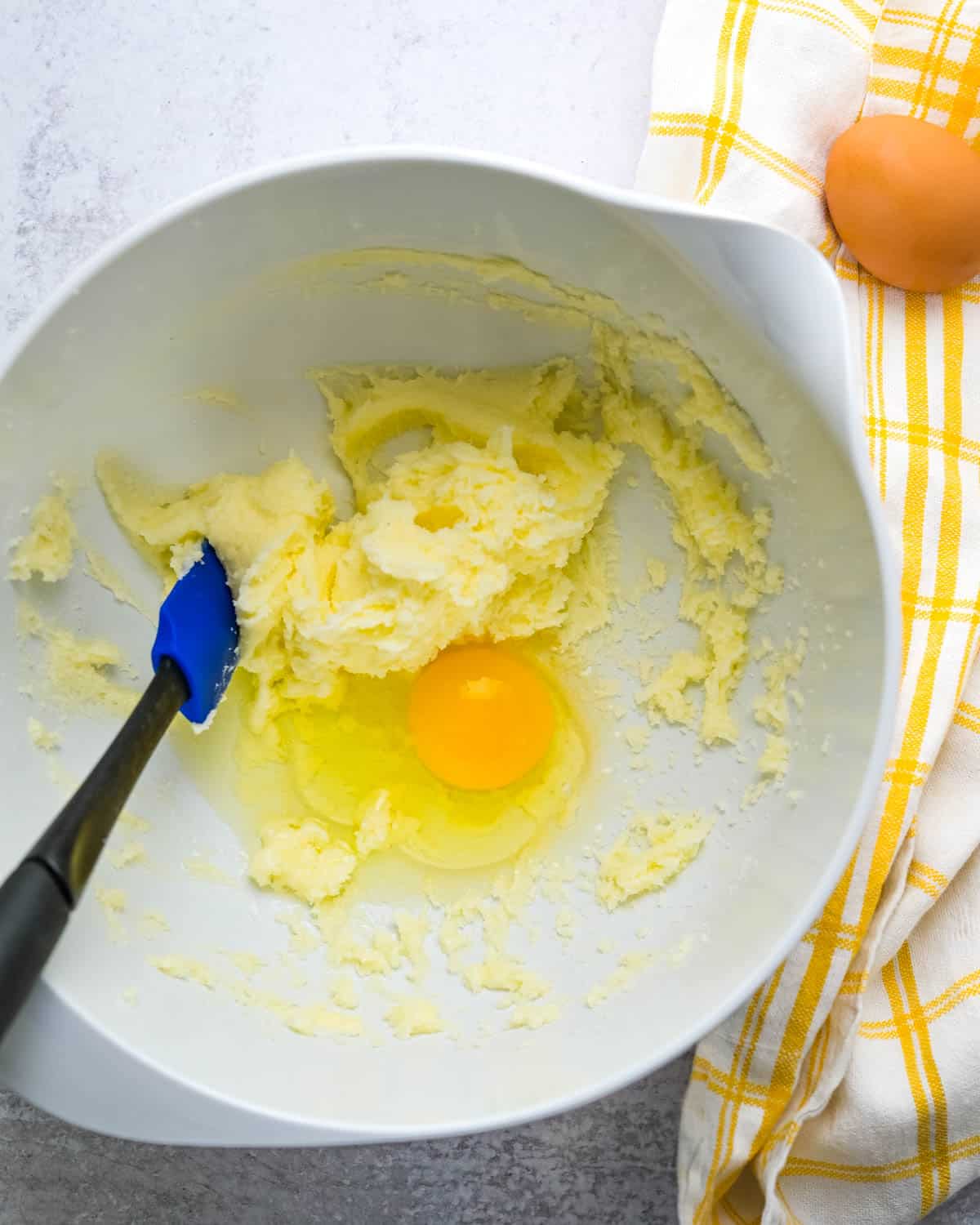 creaming the butter and sugar with egg.
