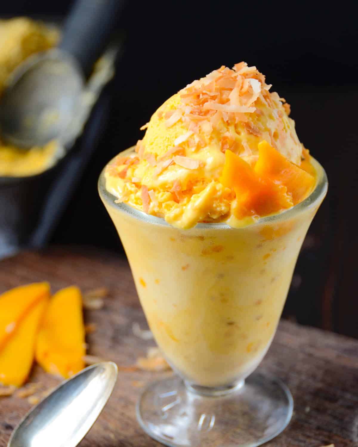 A dessert dish filled with mango ice cream. 