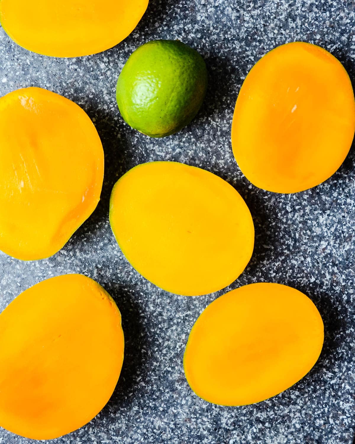 Slicing mango and lime for the ice cream recipe.