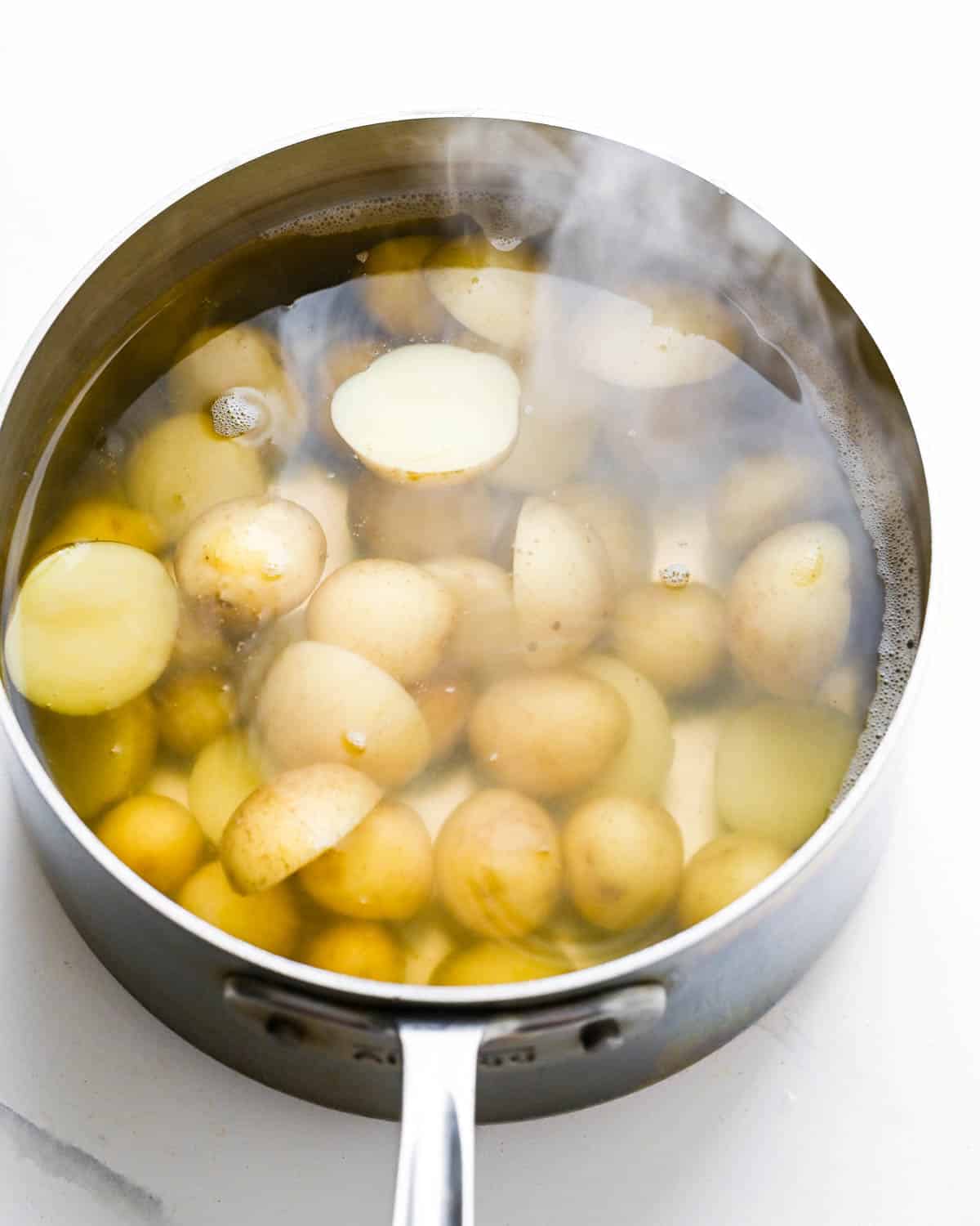 Boiled new potatoes in a pot. 