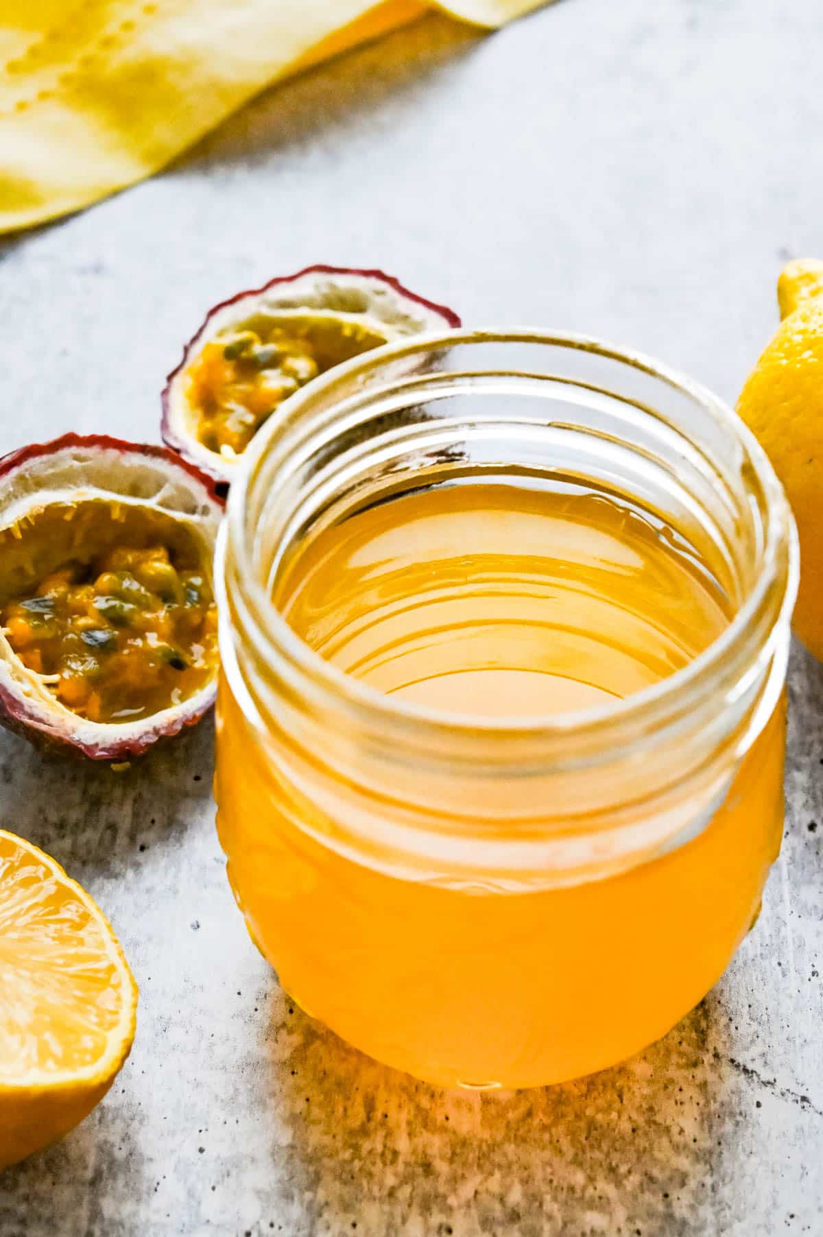 Passion fruit simple syrup in a glass jar.