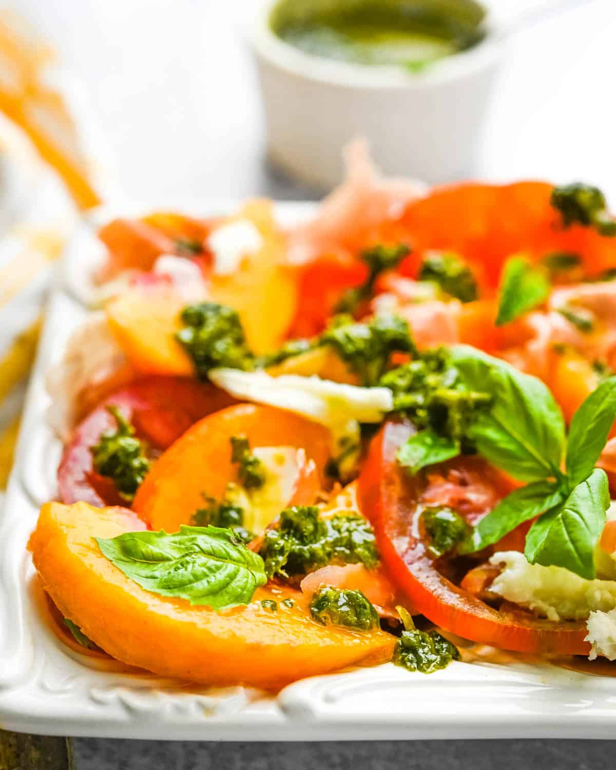 A closeup photo of the tomato and peach salad.