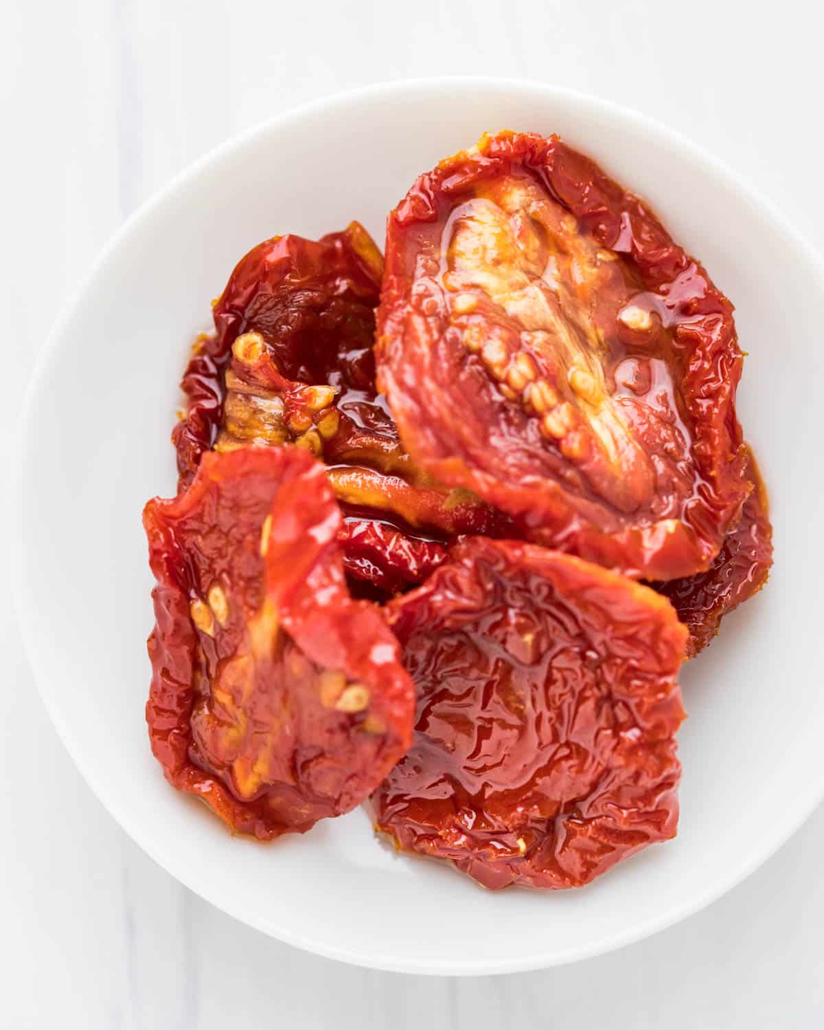 sun-dried tomatoes on a white dish.