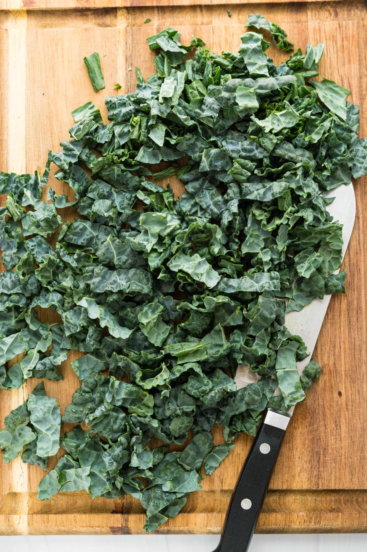 Chopping the kale into ribbons.