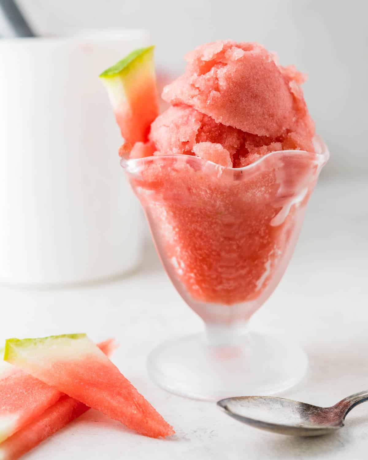 An ice cream dish filled with watermelon sorbet.