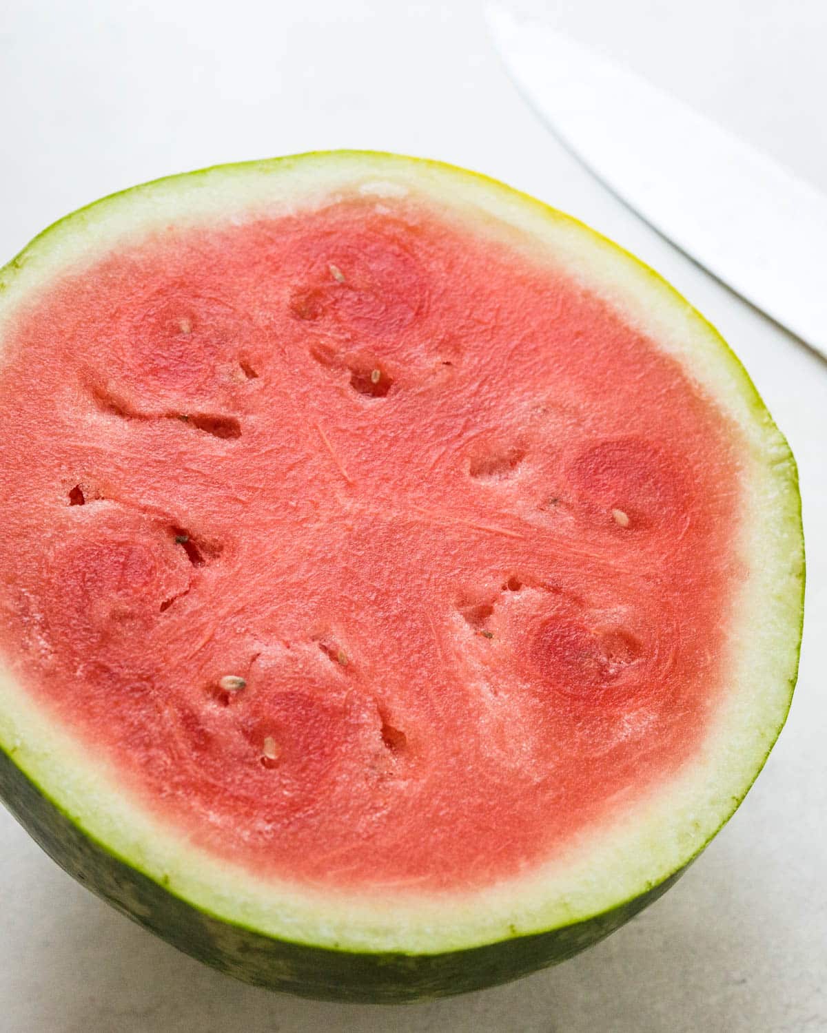 A watermelon, cut in half.