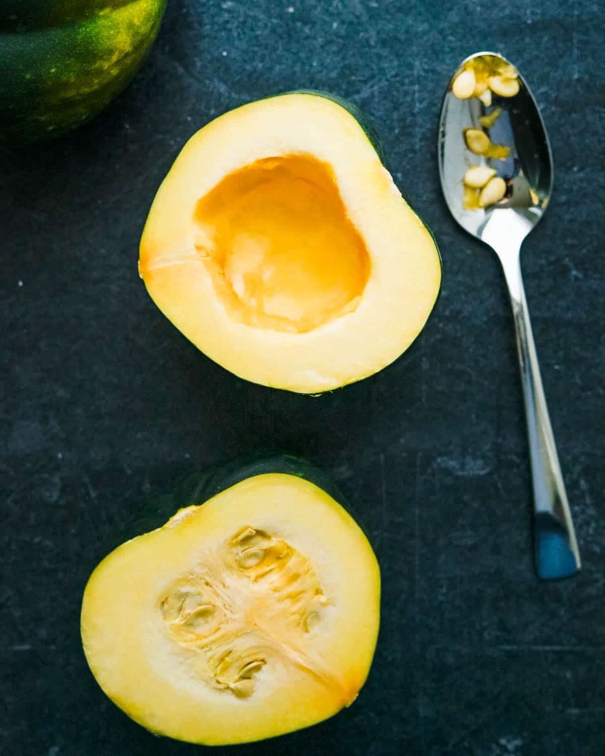 removing the seeds from the acorn squash.